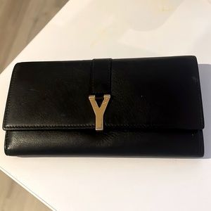YSL wallet. 2 pockets, zip pouch and slots for up to 12 cards.